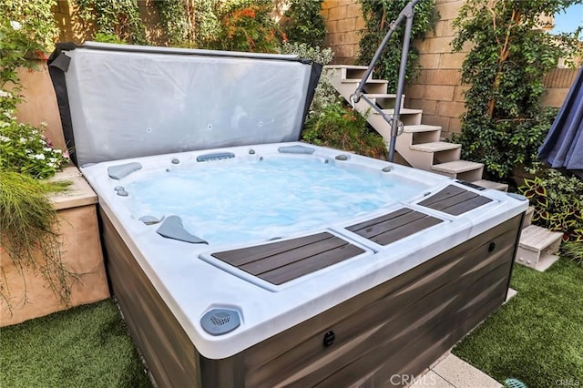 exterior space featuring a hot tub