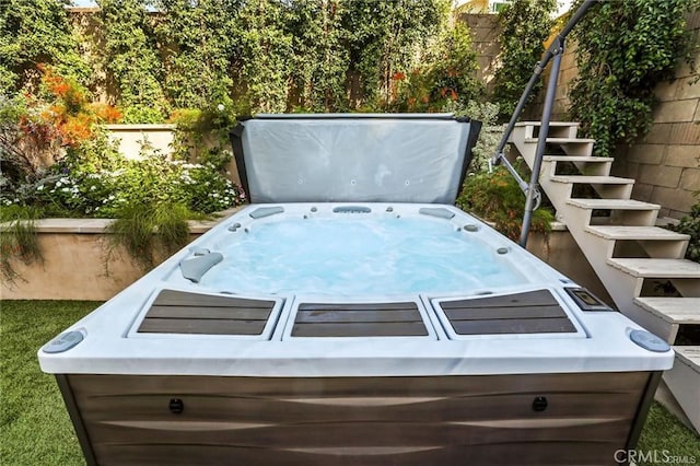 exterior space featuring a hot tub