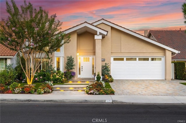 view of front of property with a garage