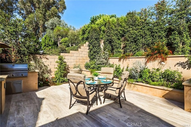 view of patio with a grill and exterior kitchen