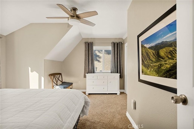 bedroom with ceiling fan, light colored carpet, and lofted ceiling