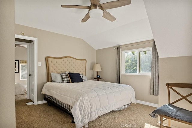 carpeted bedroom with vaulted ceiling and ceiling fan