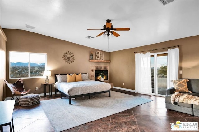 bedroom featuring ceiling fan, access to exterior, vaulted ceiling, and a mountain view