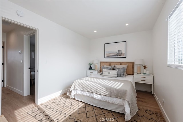 bedroom with light hardwood / wood-style floors