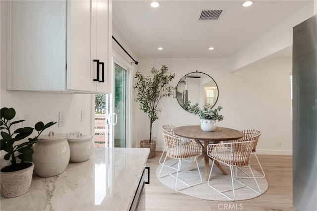 dining room with light hardwood / wood-style floors