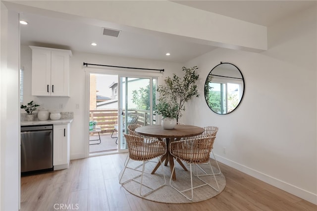 dining area with light hardwood / wood-style flooring