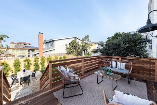 wooden deck with an outdoor hangout area