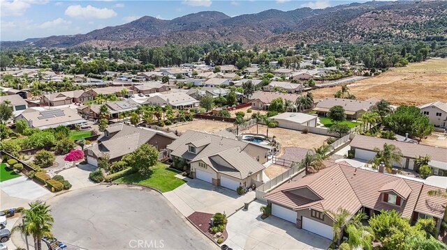 birds eye view of property featuring a mountain view