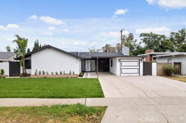 ranch-style home featuring a front yard and a garage