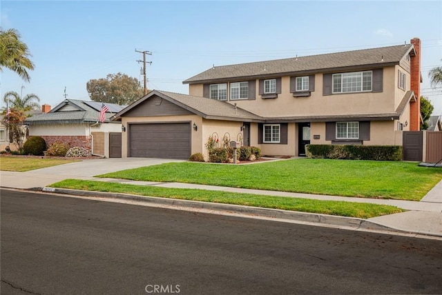 view of front of home with a front lawn and a garage