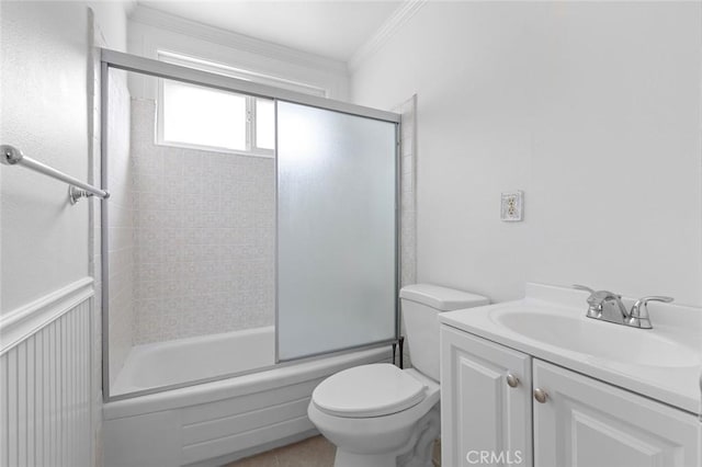 full bathroom with toilet, vanity, enclosed tub / shower combo, and ornamental molding