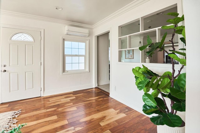 entrance foyer featuring a wall mounted AC, ornamental molding, and wood-type flooring