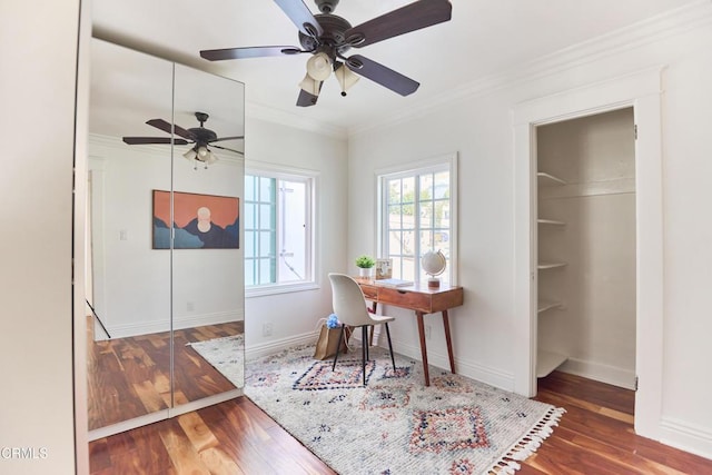 home office featuring dark wood-type flooring and ornamental molding