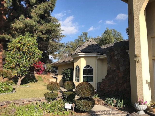 view of home's exterior with a yard