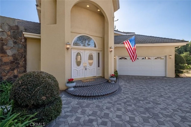 property entrance with a garage