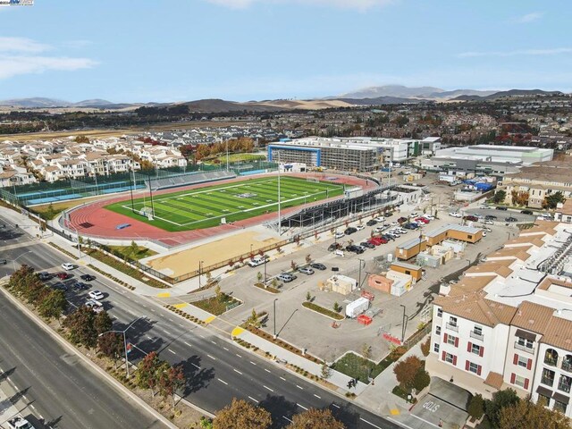 birds eye view of property with a mountain view