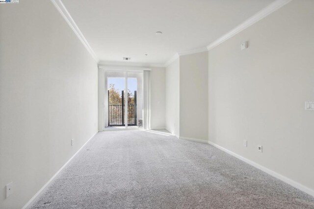 carpeted empty room with crown molding