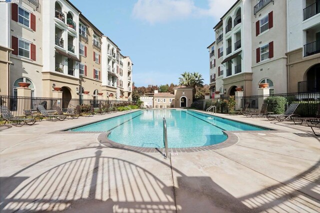 view of pool featuring a patio area