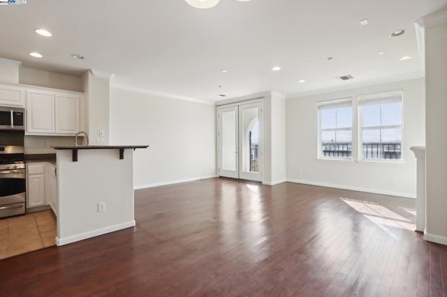 interior space with dark wood-type flooring and crown molding