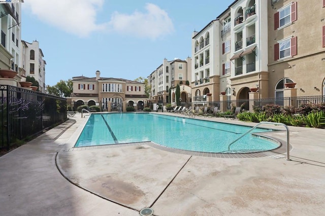 view of pool featuring a patio area