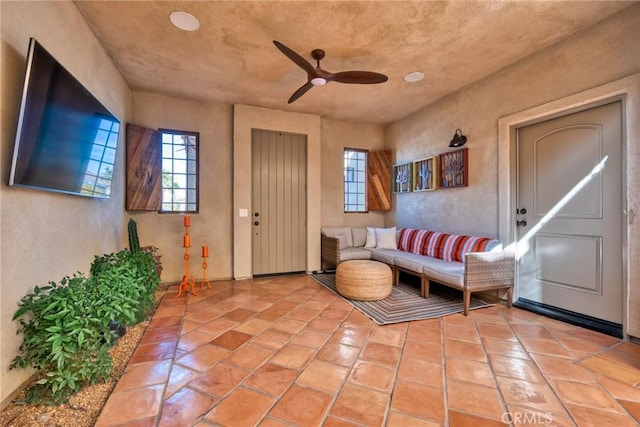 interior space featuring ceiling fan