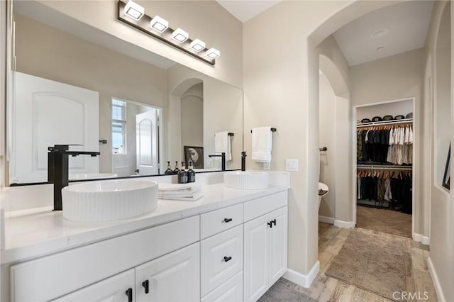 bathroom featuring vanity and hardwood / wood-style flooring