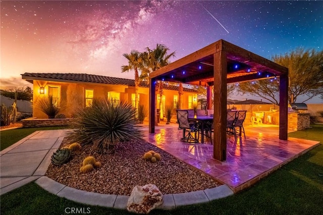 patio terrace at dusk with area for grilling