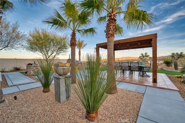 view of patio terrace at dusk