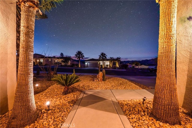 view of home's community with a patio area