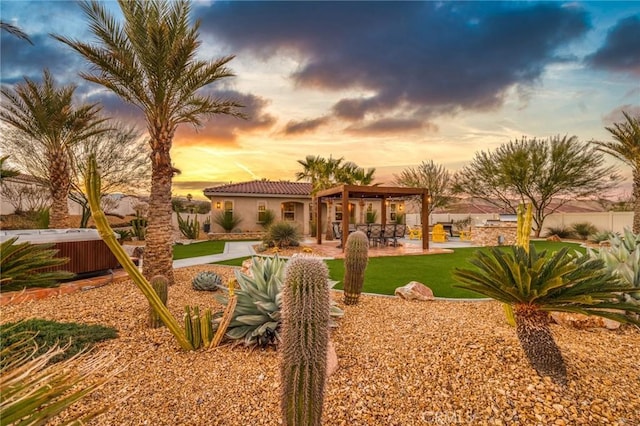 yard at dusk featuring cooling unit, a hot tub, and a patio