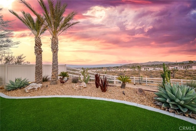 yard at dusk with a mountain view