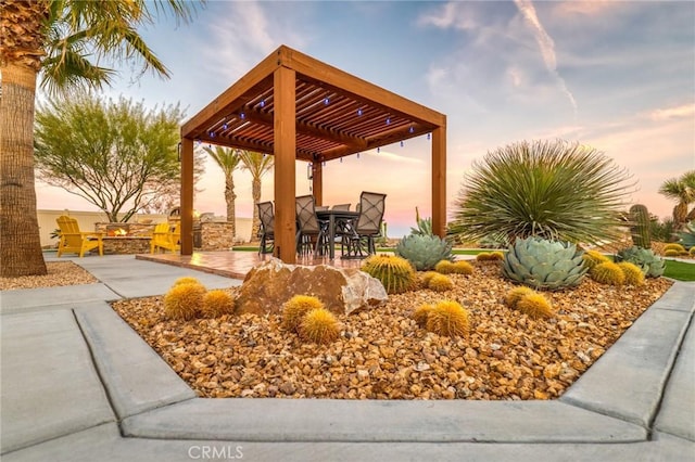 view of property's community with a pergola and a patio area