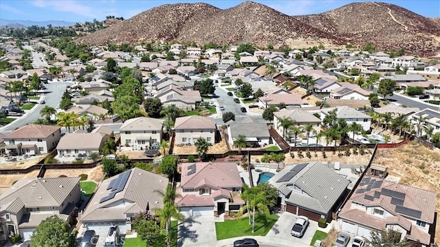 birds eye view of property with a mountain view