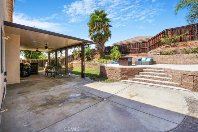 view of patio featuring ceiling fan