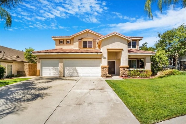 mediterranean / spanish house with a front lawn and a garage