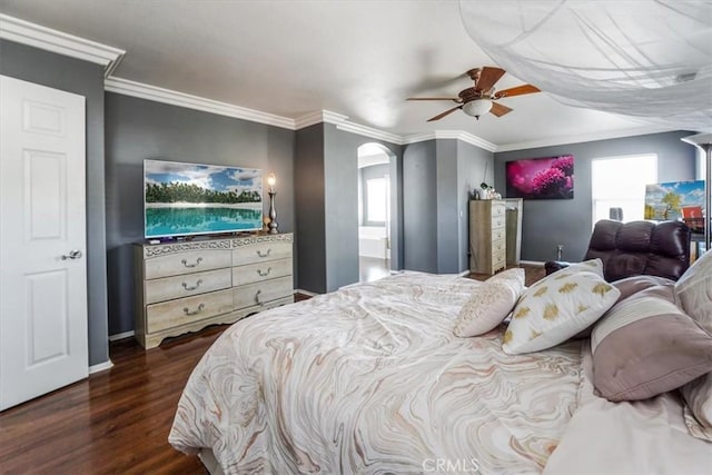 bedroom featuring ceiling fan, dark wood-type flooring, and ornamental molding