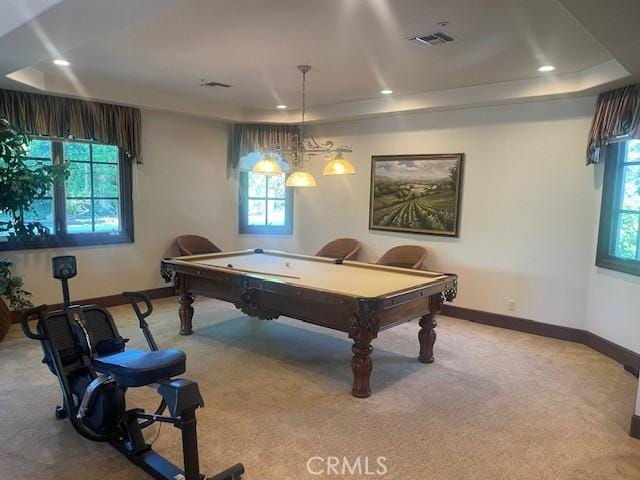 playroom with light colored carpet, pool table, and a tray ceiling