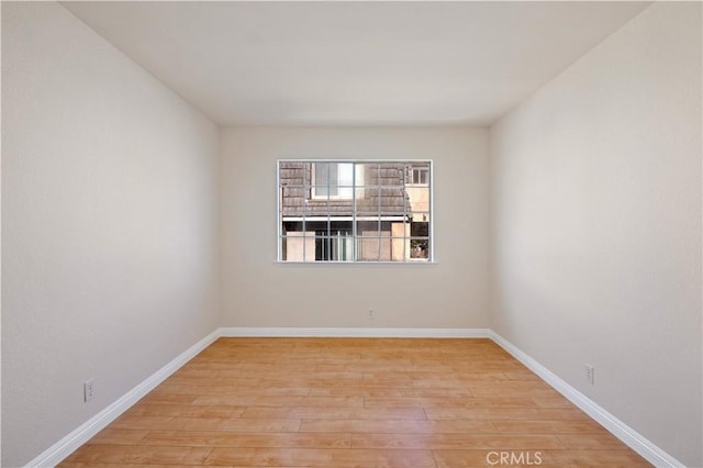 spare room with light wood-type flooring