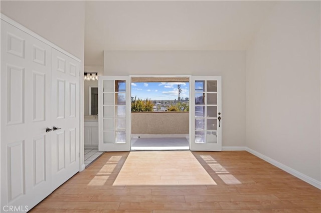 entryway featuring light hardwood / wood-style flooring and french doors