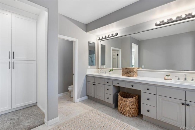 bathroom with toilet and vanity