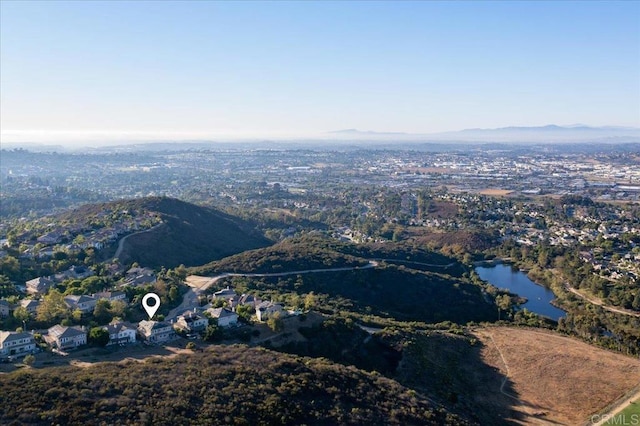 aerial view featuring a water and mountain view