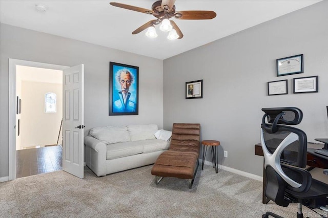 carpeted office with ceiling fan