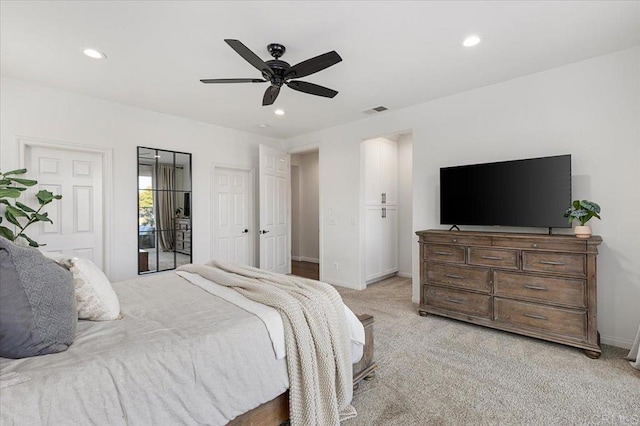 bedroom with ceiling fan, light carpet, and access to outside