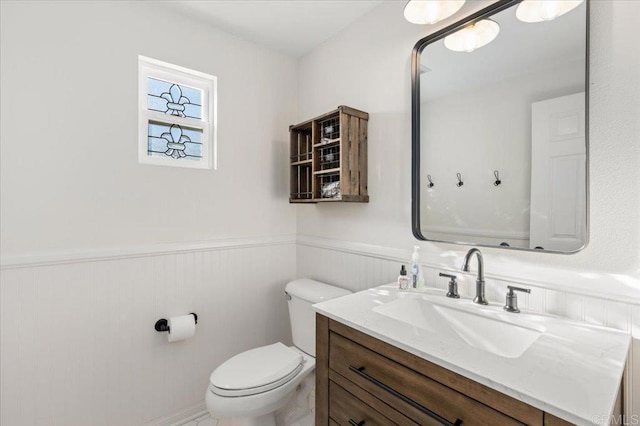 bathroom featuring toilet and vanity