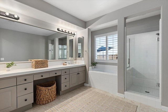 bathroom with tile patterned flooring, vanity, and plus walk in shower