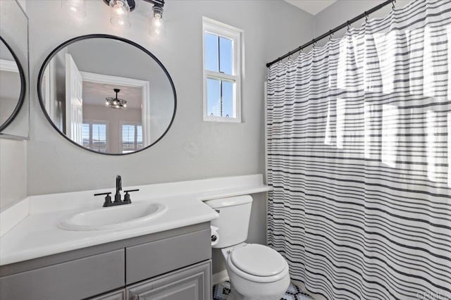 bathroom with toilet and vanity