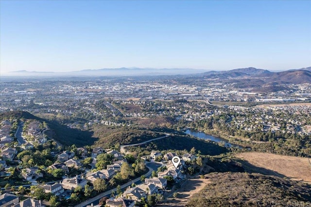 drone / aerial view featuring a mountain view