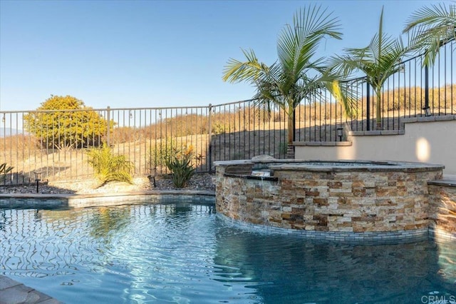 view of pool with pool water feature