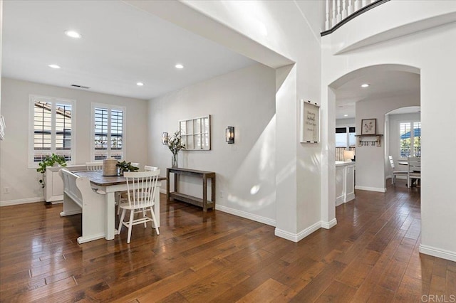 dining room with dark hardwood / wood-style flooring