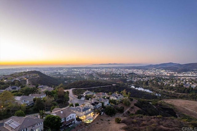 aerial view at dusk with a water view